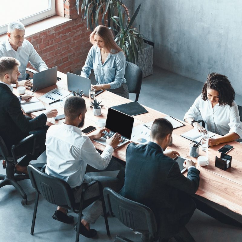 Multiethnic Business Team Working Together Sitting In Modern Office, Panorama